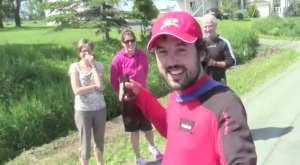 Adventure runner Jamie McDonald gets a welcome cold beer on his trek across Canada. Image: YouTube.