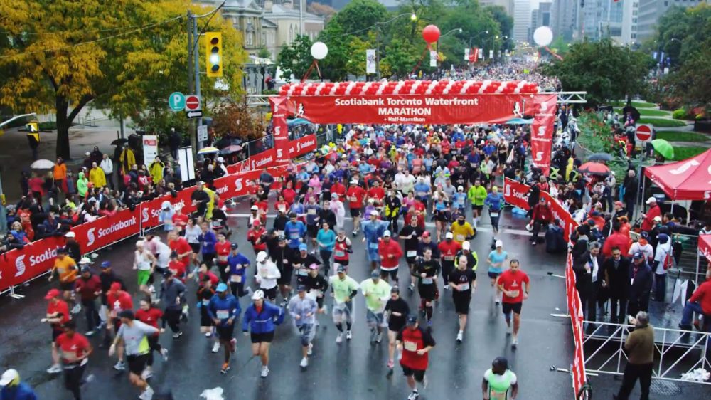 Runners crossing the start line of the 2012 Scotiabank Toronto Waterfront Marathon