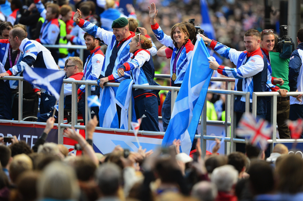 GLASGOW, SCOTLAND - SEPTEMBER 14: Katherine Grainger and other Olympians wave to members of the public in Buchanan Street during the Olympic Parade on September 14, 2012 in Glasgow, Scotland. Thousands of people lined the streets to welcome the homecoming parade for Scotland's Olympic and Paralympic athletes.  (Photo by Jeff J Mitchell/Getty Images)