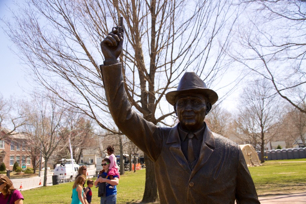 A statue of the Boston Marathon starter in Hopkinton's town square.