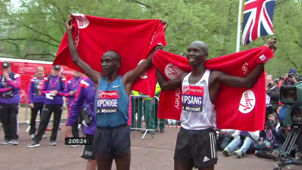Eliud Kipchoge and Wilson Kipsang celebrate together after placing first and second at the 2015 London Marathon.