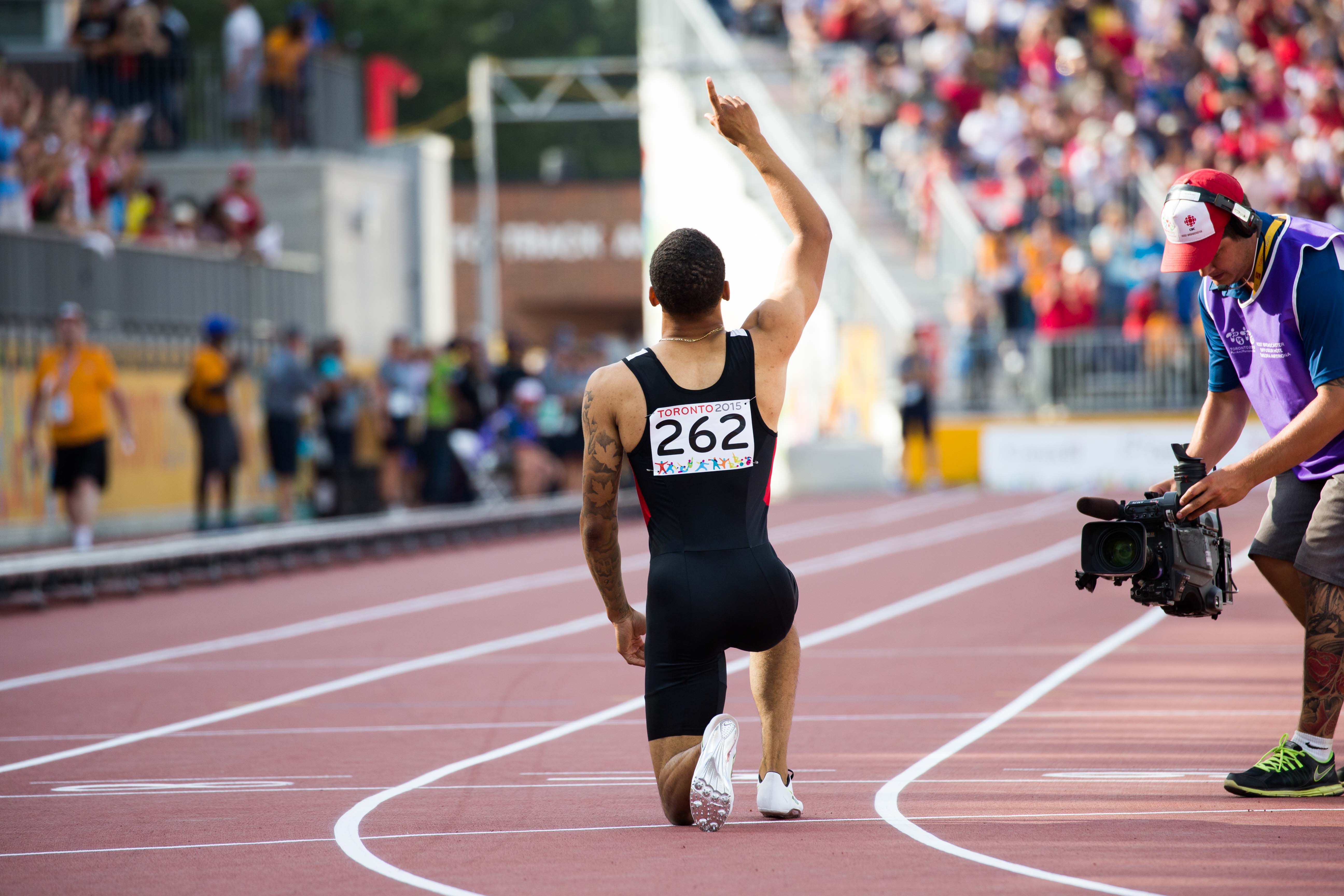 Andre De Grasse celebrates after winning the men's 200m at the Pan American Games