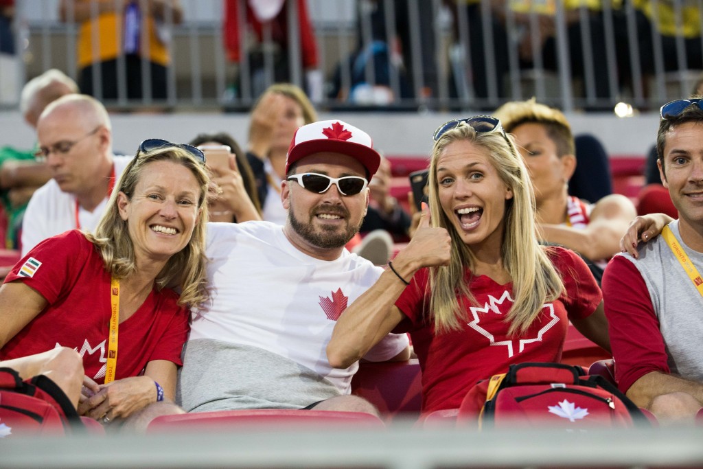 Natasha Wodak cheers on her Canadian teammates from the stands.