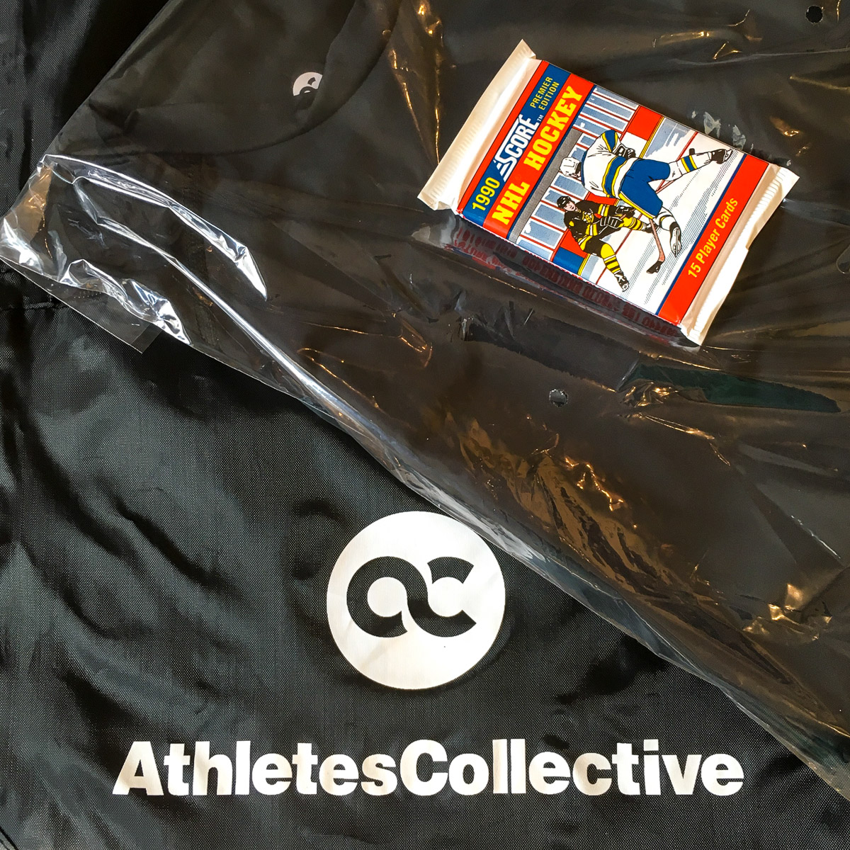 The "welcome package" includes an Athletes Collective bag and a pack of throwback hockey cards. Our package featured a Chris Draper rookie card.