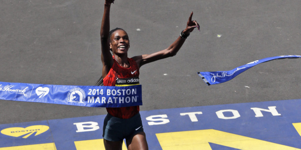 Rita Jeptoo, of Kenya, breaks the tape to win the women's division of the 118th Boston Marathon Monday, April 21, 2014 in Boston. (AP Photo/Charles Krupa)