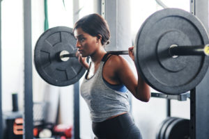 woman working out with a barbell