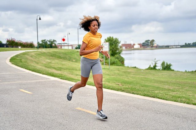 woman running by Jeremy Stewart
