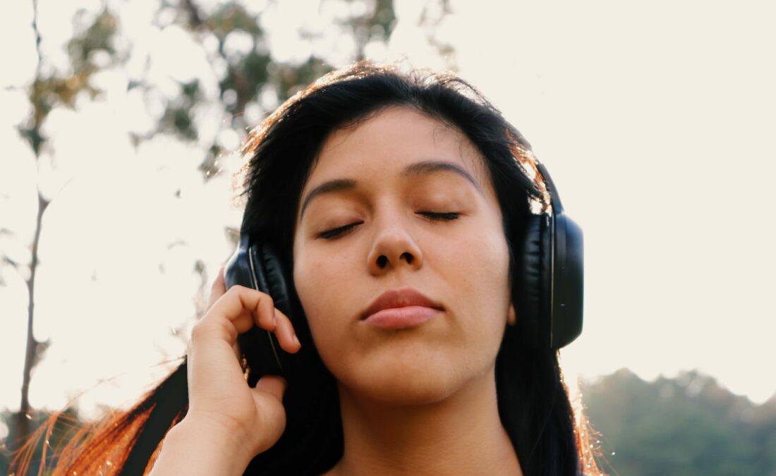 Person listening with headphones