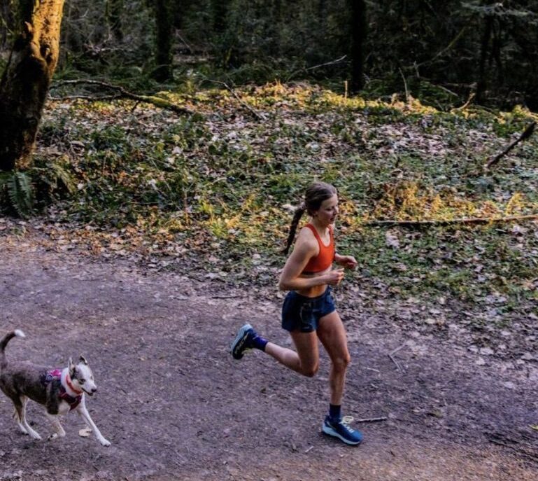 Keely Henninger running with dog