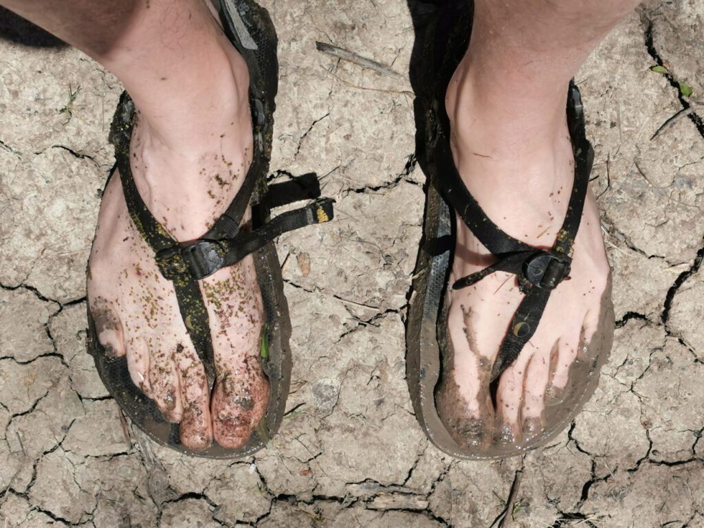 sandals in mud