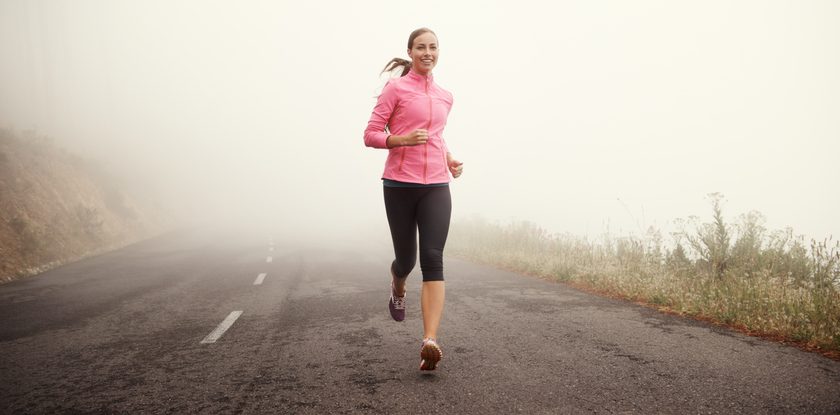 woman running in fog