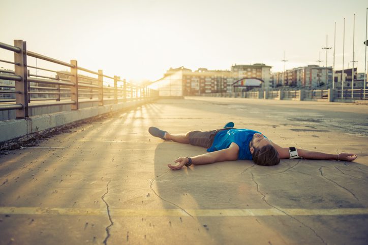exhausted runner lying down