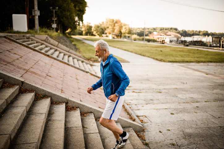 older runner on stairs