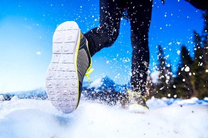 Legs of a runner in snow