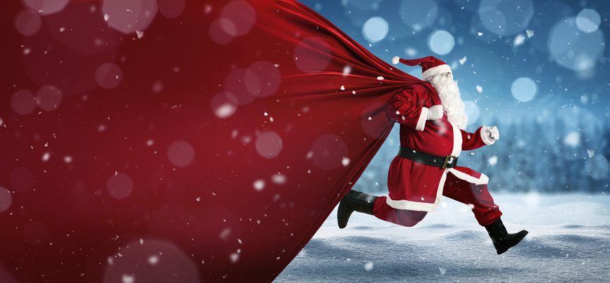 Santa Claus on the run to delivery christmas gifts