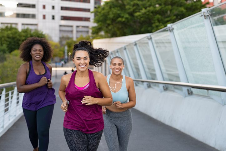 group of happy women runners