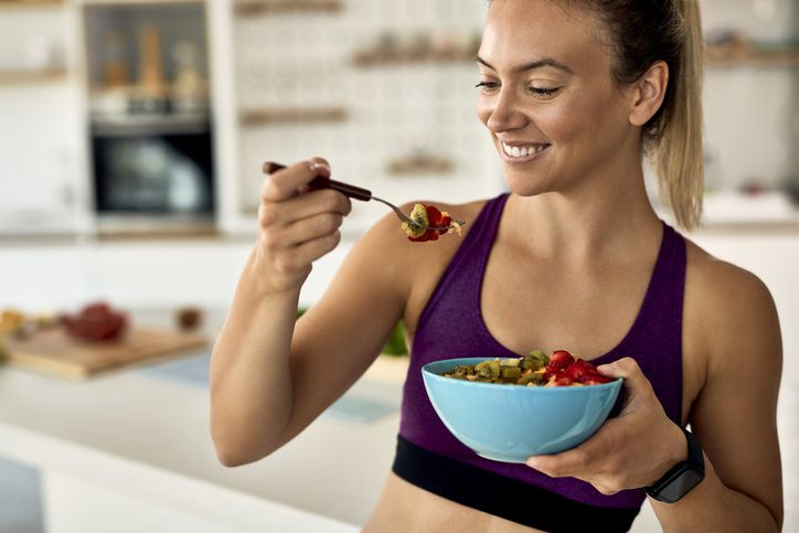 runner eating bowl of cereal and berries